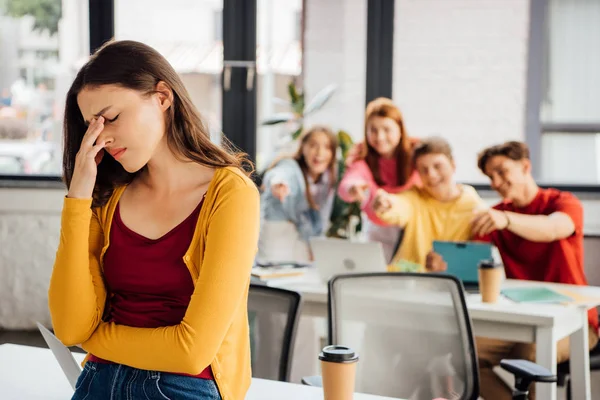 depositphotos 298852078 stock photo sad girl laughing schoolchildren pointing